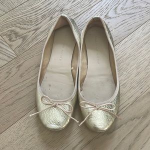 Zara woman’s gold ballet shoe